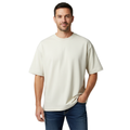 Man wearing a beige t-shirt and blue jeans on a white background