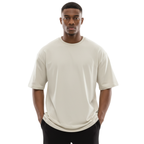 Man wearing an off-white Macbee oversized t-shirt on a white background