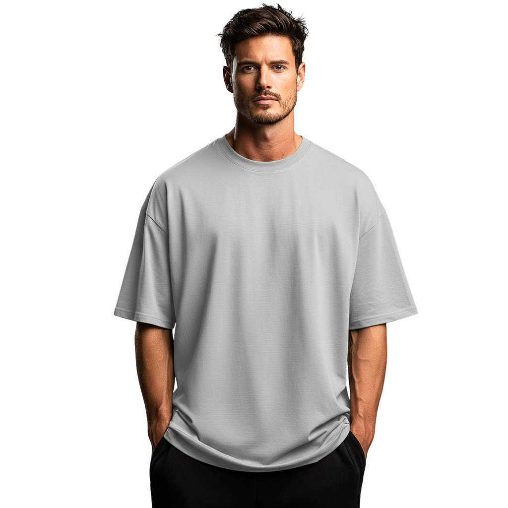 Man wearing a gray Macbee oversized t-shirt on a white background
