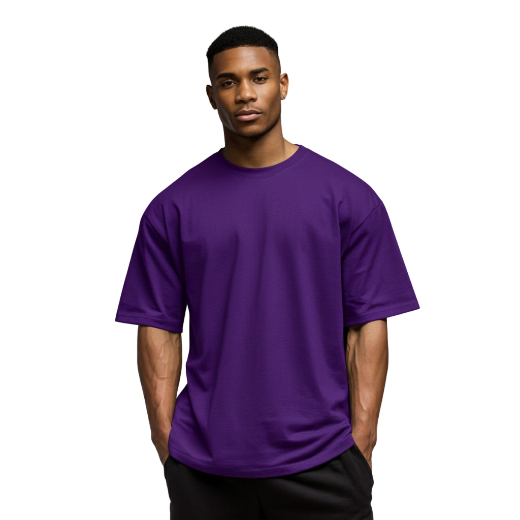 Man wearing a purple Macbee oversized t-shirt on a white background