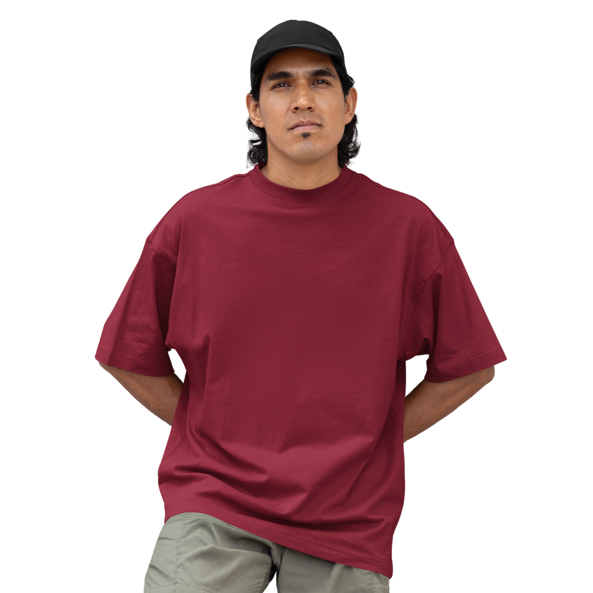 Man wearing a marsala Macbee oversized t-shirt and black cap on a white background