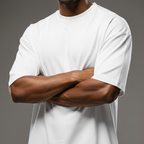 Person wearing a plain white Macbee oversized t-shirt with arms crossed on a gray background